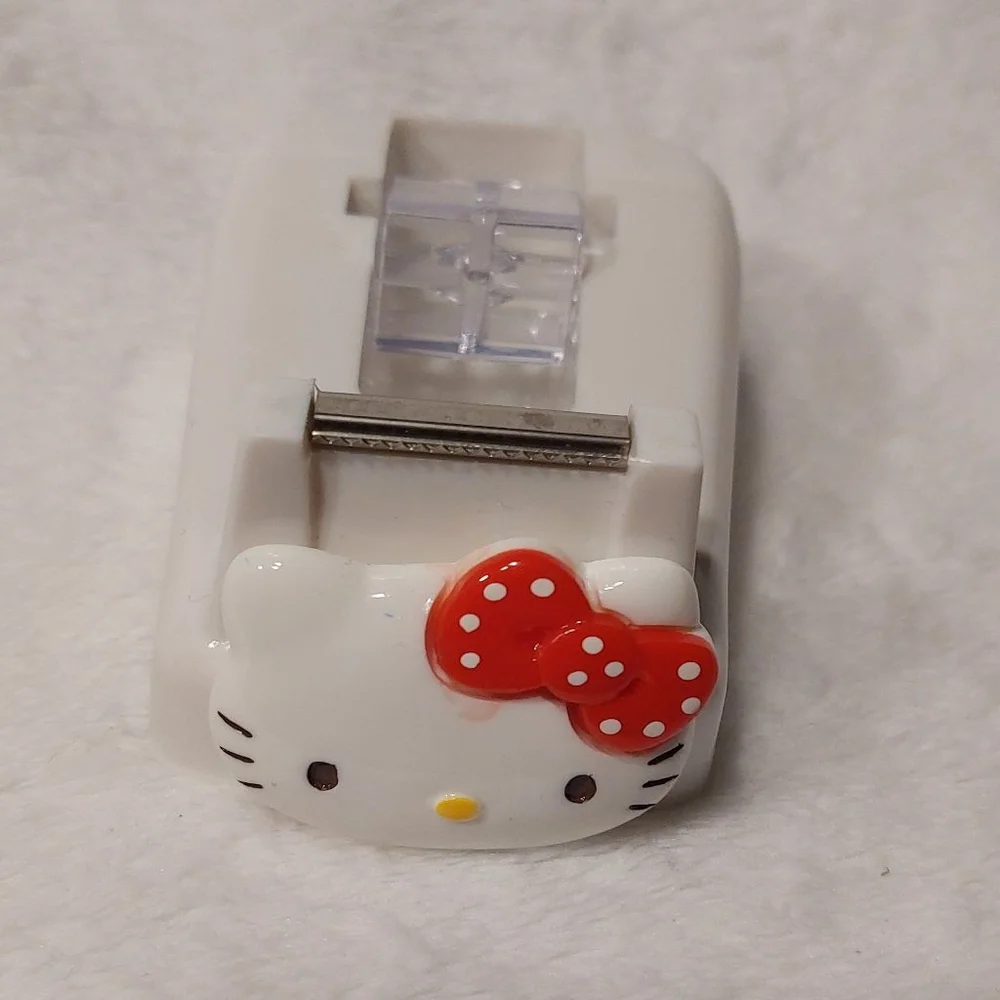 Make projects fun when you use this Hello Kitty White and Red Tape Dispenser
